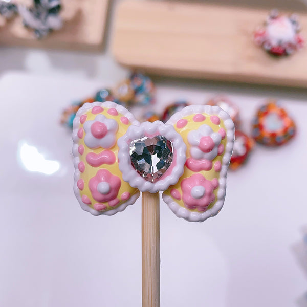 Heart-Bound Sparkle: Individually Hand-Painted Shaped Bow Bead