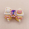 Radiant Ribbon: Individually Hand-Painted Squishy Zircon Bow Bead